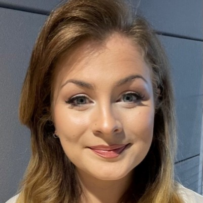 Person smiling with light brown hair