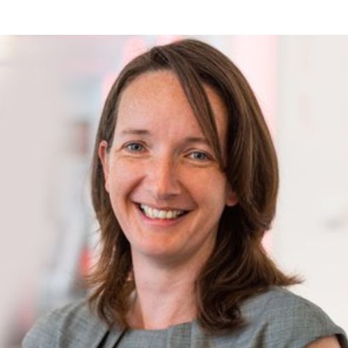 Person smiling in a professional setting.