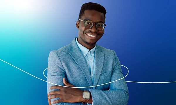 A young man, smiling brightly
