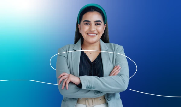 A young woman in business casual, smiling brightly