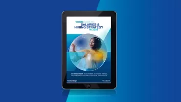 E-book cover on salaries and hiring strategy for 2023 displayed on a tablet.