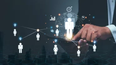 Businessman interacting with digital network of connected figures