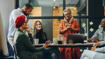 Group of people having a meeting in a modern office setting.