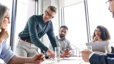 Group of professionals having a meeting in a modern office.