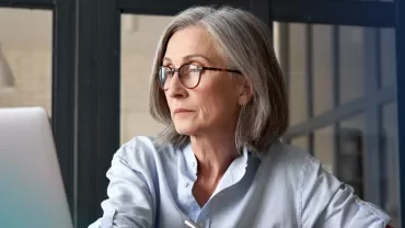 professional woman looking at her computer