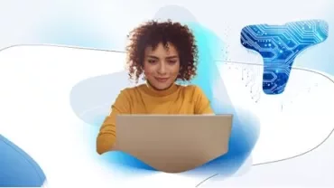 Woman at computer with Talent Trends backdrop