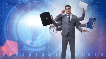 Person multitasking, holding clock, briefcase, laptop, folder, and phone against digital world map background.