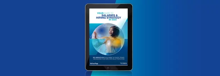 E-book cover on salaries and hiring strategy for 2023 displayed on a tablet.