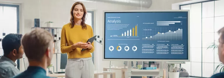 Person presenting a data analysis chart in a meeting room.
