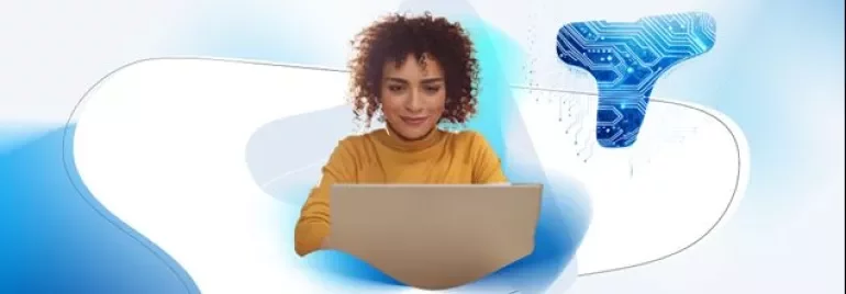 Woman at computer with Talent Trends backdrop