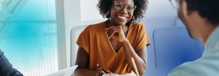 smiling woman who is hiring an interim manager