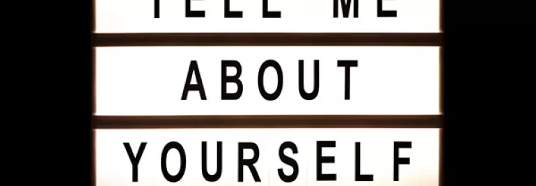 Lightbox displaying the words 'Tell Me About Yourself.'