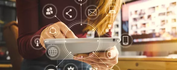 Person using a tablet with social media icons overlaid.
