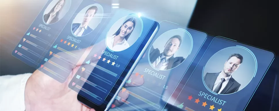 Hand interacting with digital profiles of specialists on a screen.