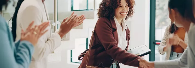 Women handshaking people