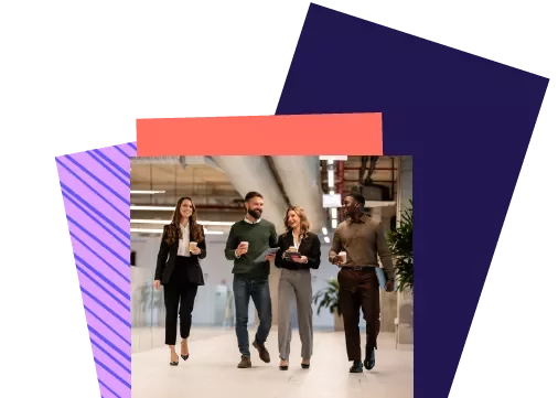 Four people walking and talking in an office setting