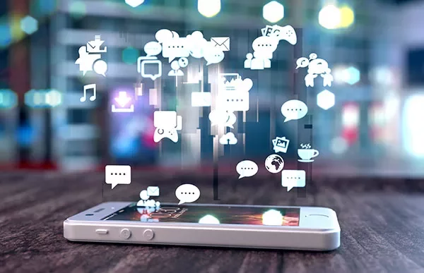 Smartphone with colorful floating app icons.