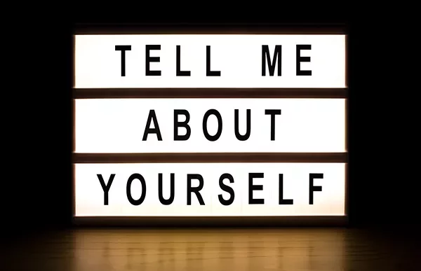 Lightbox displaying the words 'Tell Me About Yourself.'